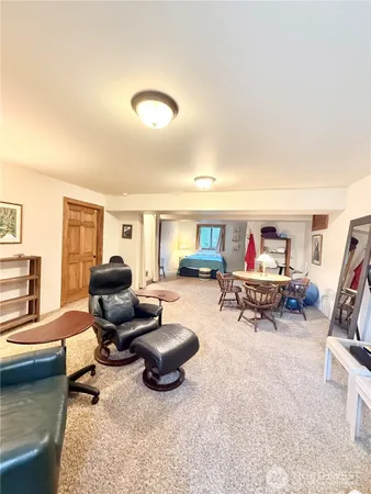a living room with furniture and a rug