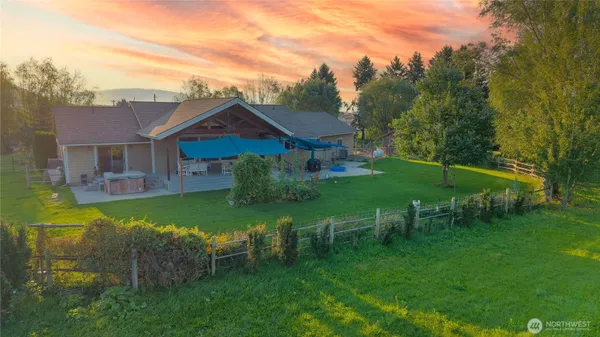 a view of a table and chairs in the garden