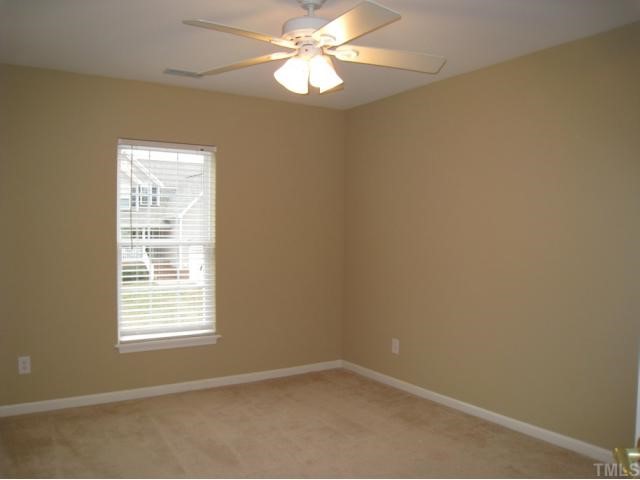 2324 Spruce Shadows Lane Raleigh, NC 27614 - Photo 11 of 12 Bedroom offers accent wall color, ceiling fan, carpet, and large closet!