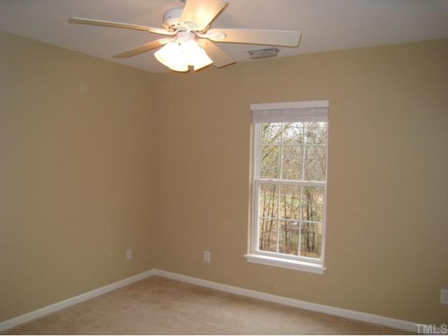 2324 Spruce Shadows Lane Raleigh, NC 27614 - Photo 10 of 12 Bedroom offers ceiling fan, carpet, accent wall color, closet!