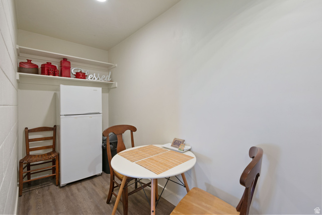 1900 North 100 East Provo, UT 84604 - Photo 39 of 49 Compact kitchen area featuring a full-size refrigerator, wood-finish flooring, and white painted walls
