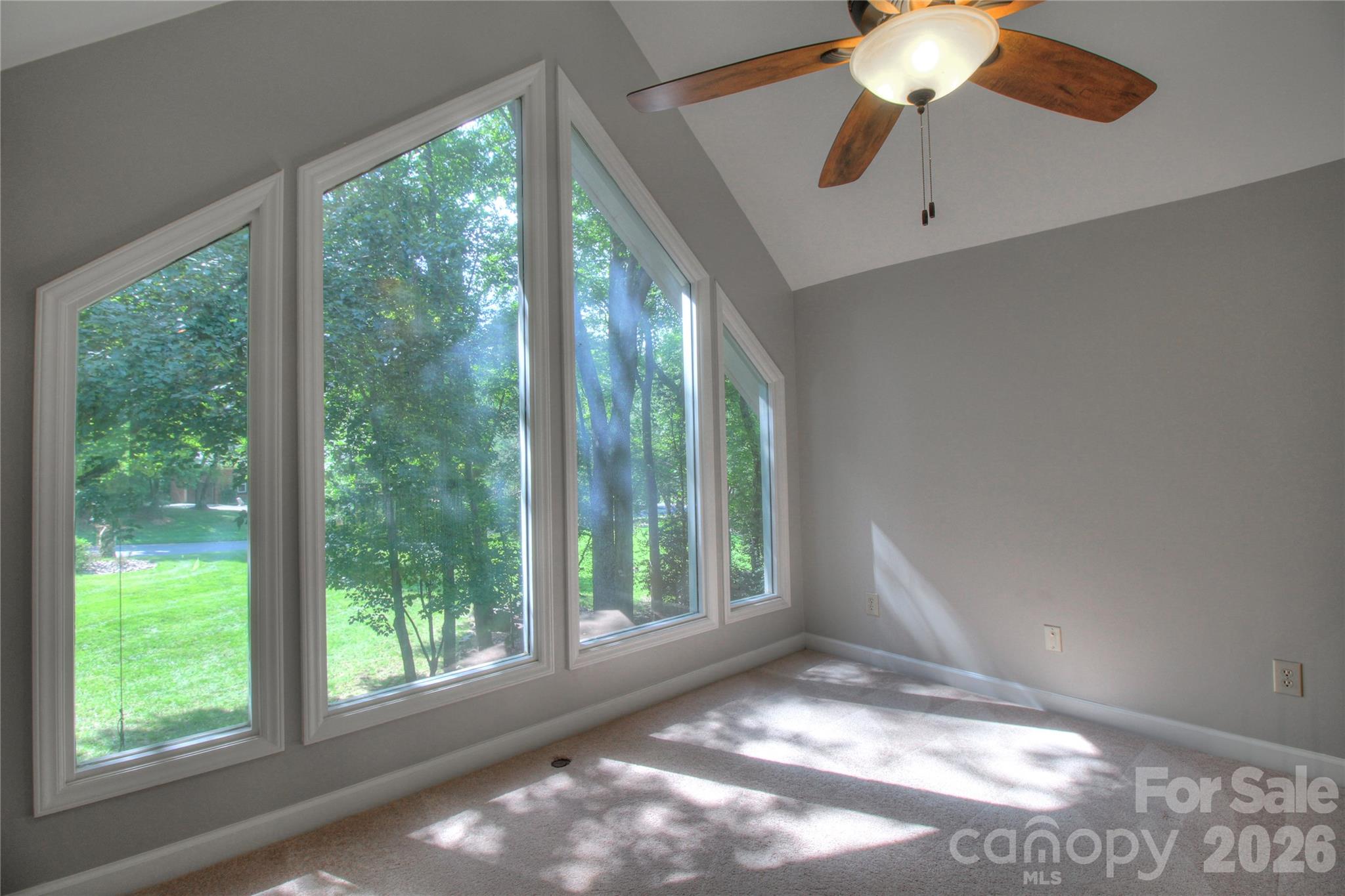 3408 Providence Manor Road Charlotte, NC 28270 - Photo 27 of 39 a view of an empty room with a window and a ceiling fan