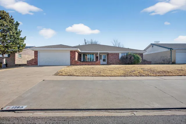 a living room with furniture fireplace and flat screen tv