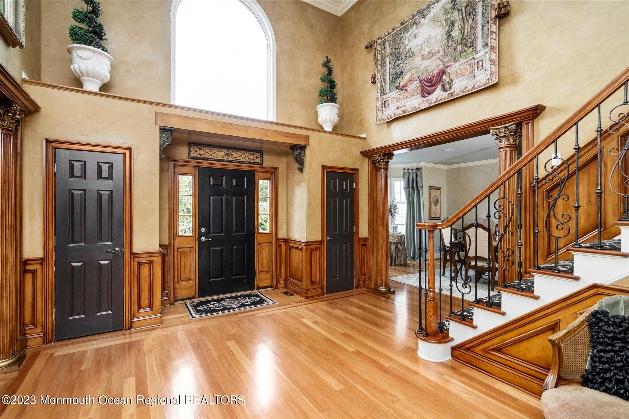 27 Millennium Drive Columbus, NJ 08022 - Photo 15 of 82 a view of a hallway with wooden floor and staircase