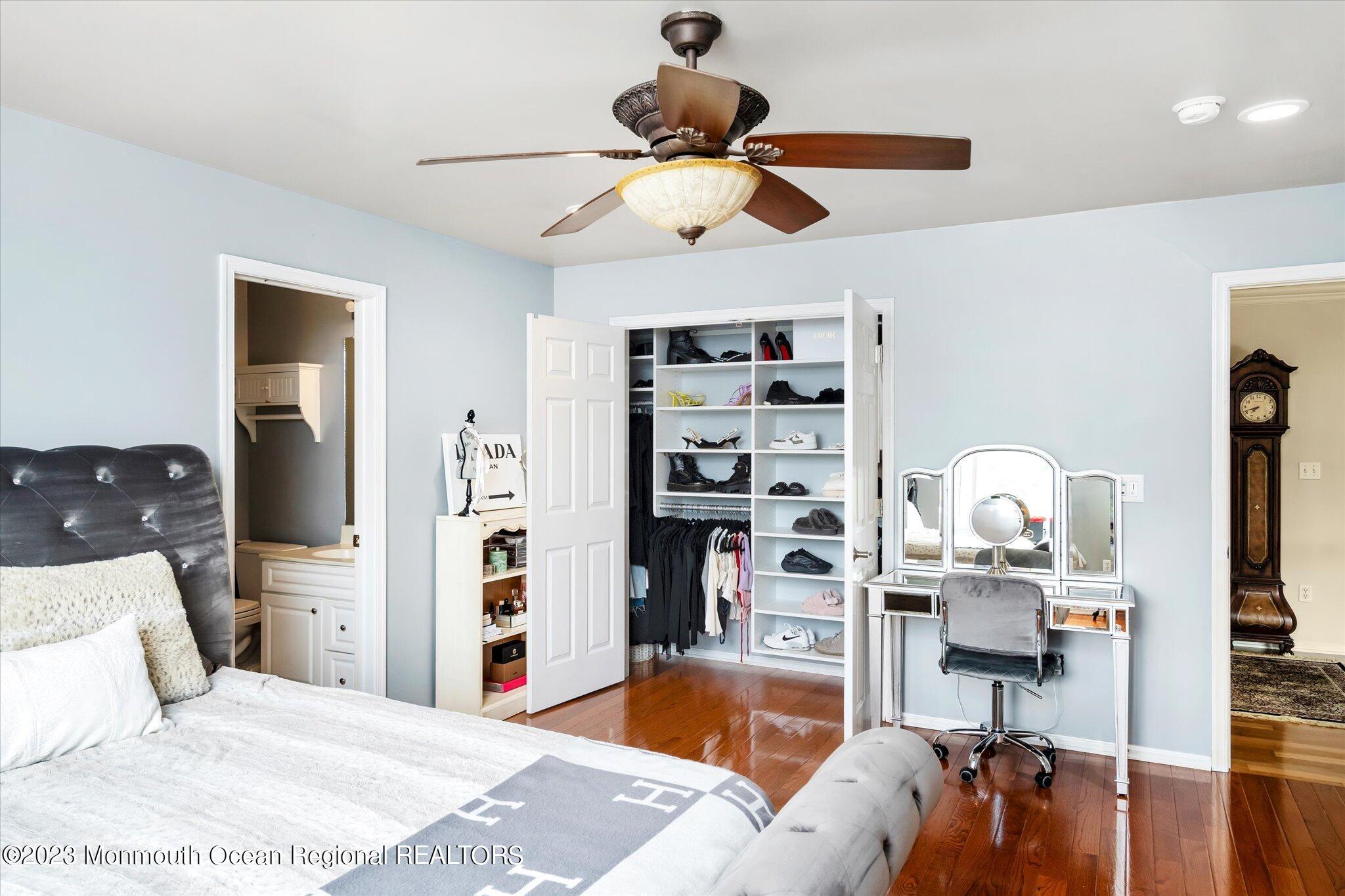 27 Millennium Drive Columbus, NJ 08022 - Photo 35 of 82 a bedroom with a bed and a chandelier