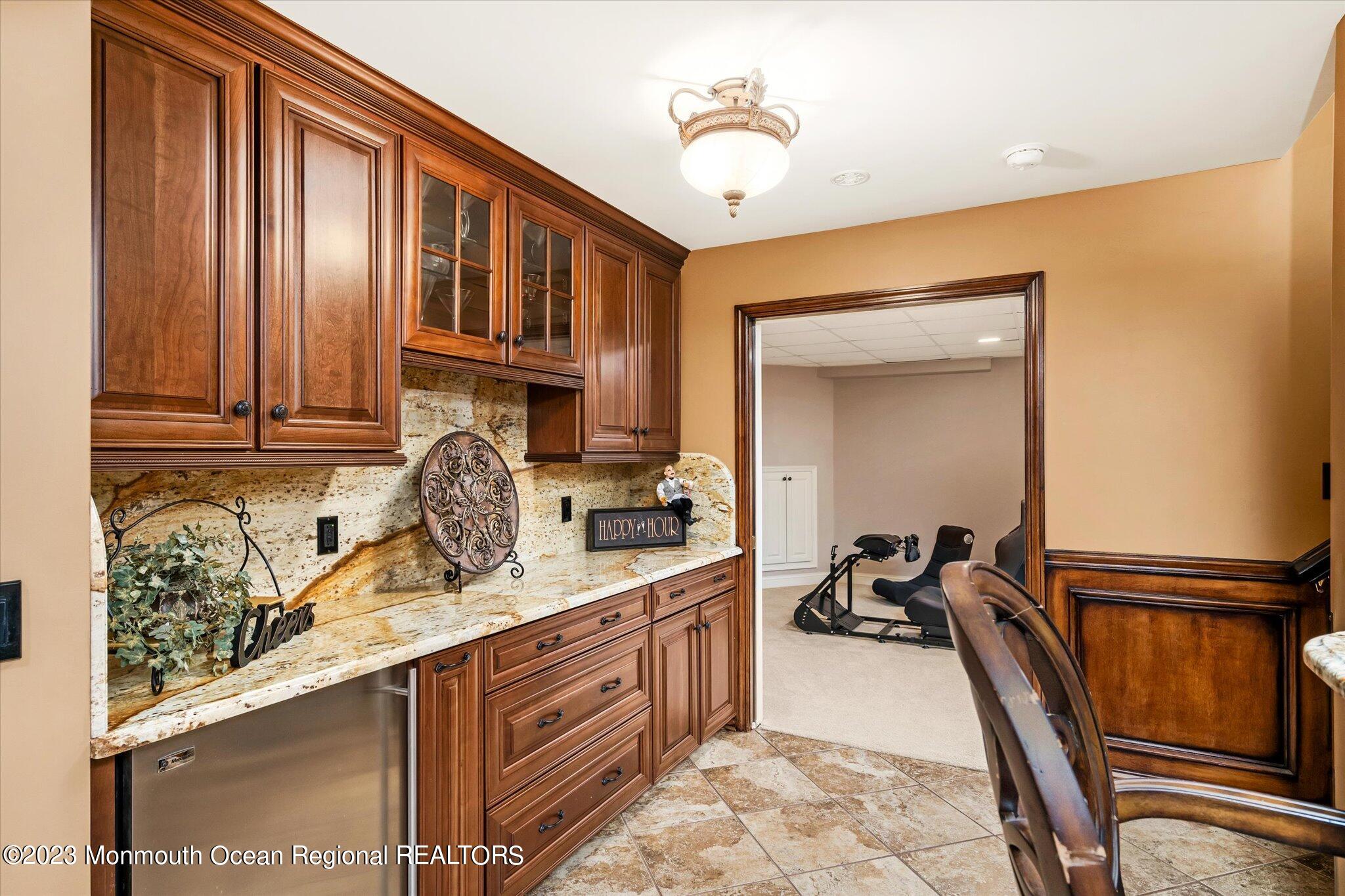 27 Millennium Drive Columbus, NJ 08022 - Photo 50 of 82 a kitchen with stainless steel appliances granite countertop a sink refrigerator and cabinets