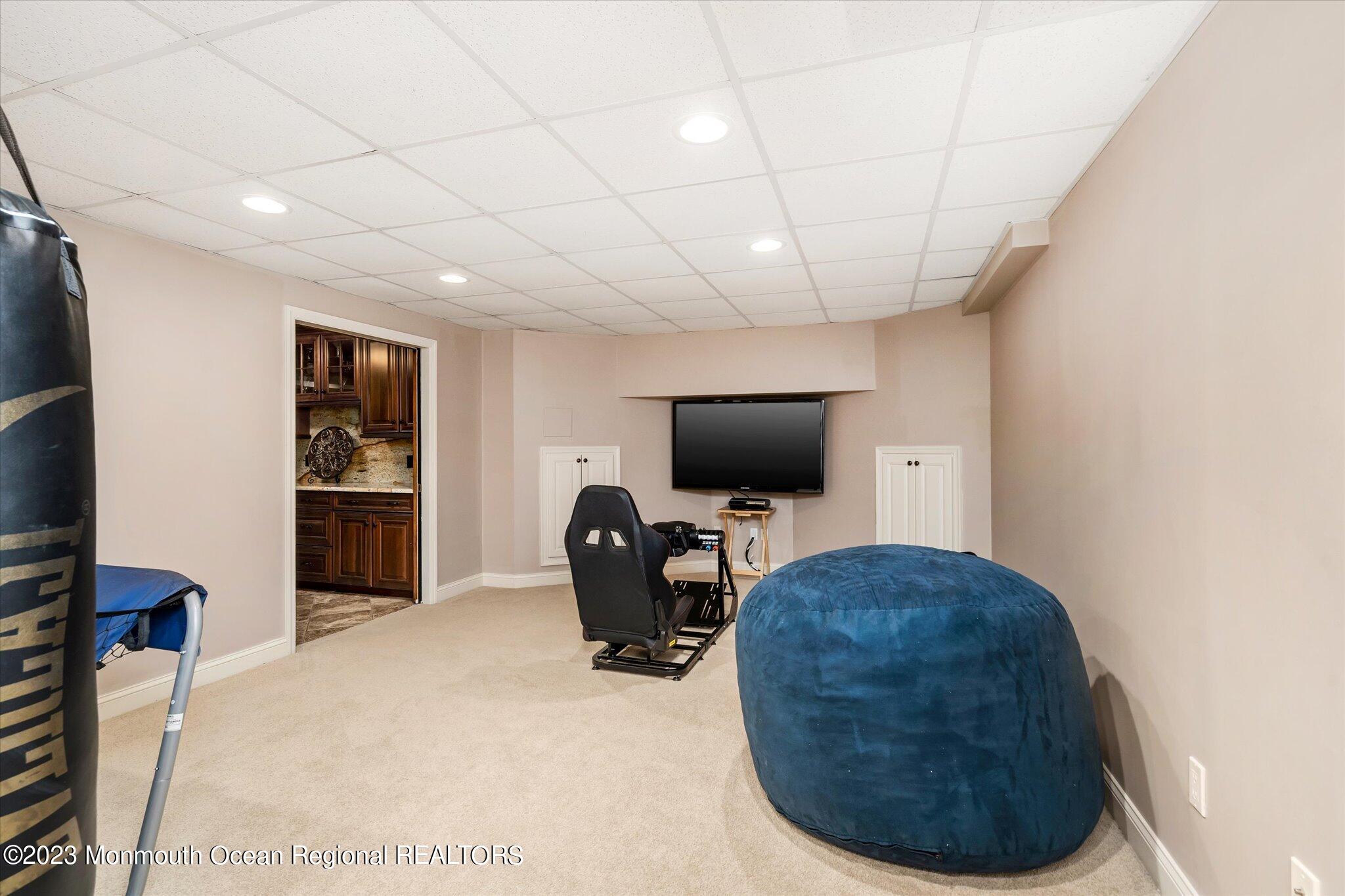 27 Millennium Drive Columbus, NJ 08022 - Photo 57 of 82 a living room with furniture and a flat screen tv