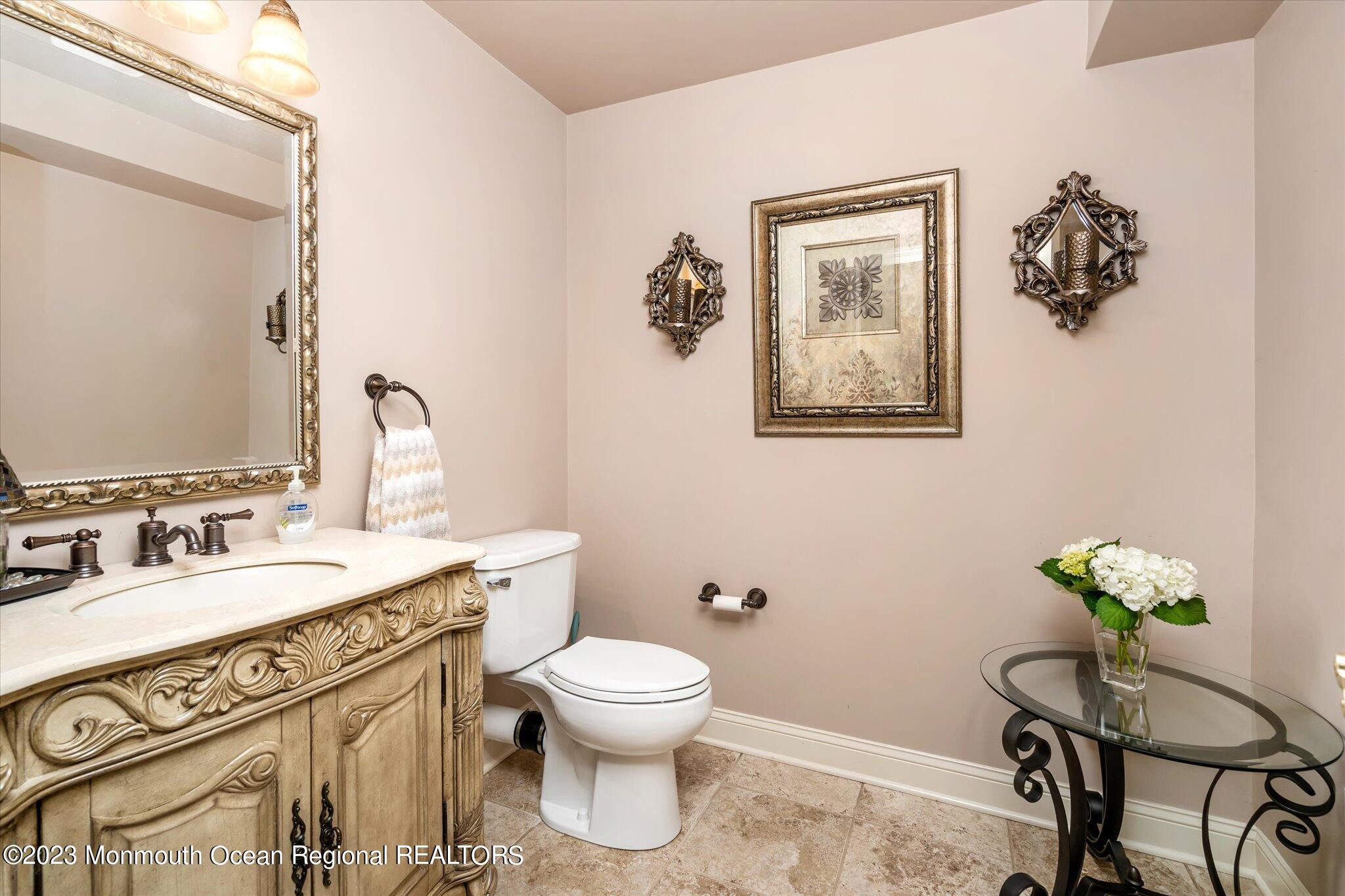 27 Millennium Drive Columbus, NJ 08022 - Photo 59 of 82 a spacious bathroom with a toilet a sink and mirror