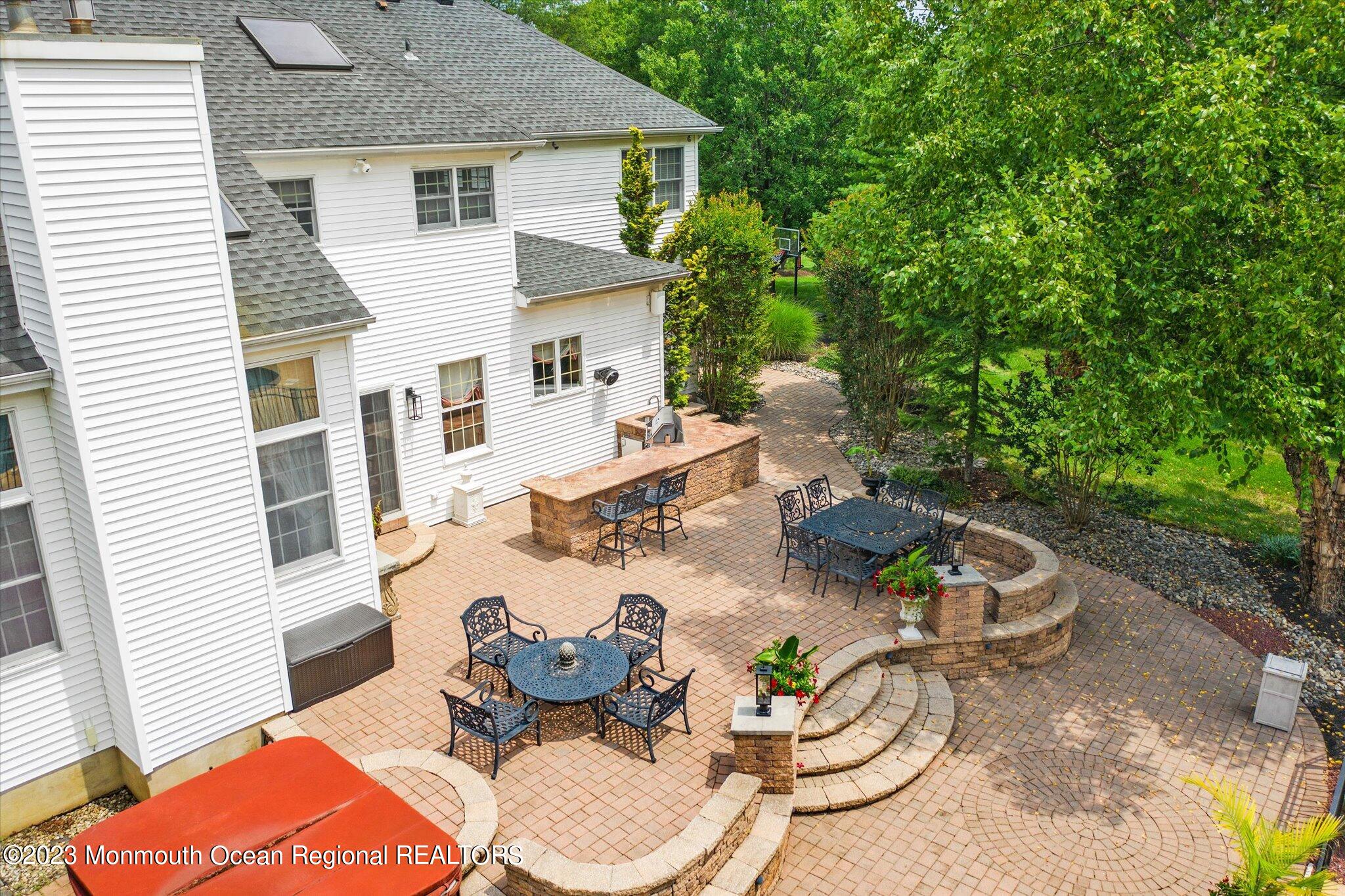 27 Millennium Drive Columbus, NJ 08022 - Photo 80 of 82 a backyard of a house with dining table and chairs