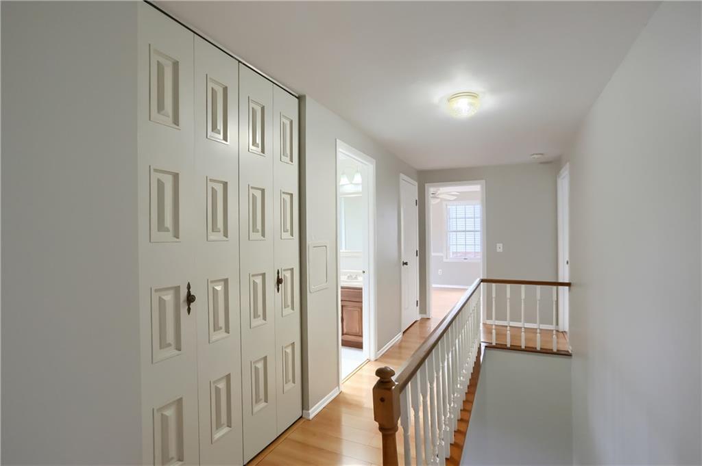 1889 Fairhill Road Allison Park, PA 15101 - Photo 16 of 25 The upstairs hallway is unique with a wrap around staircase, a double linen closet and a bonus cedar lined closet.