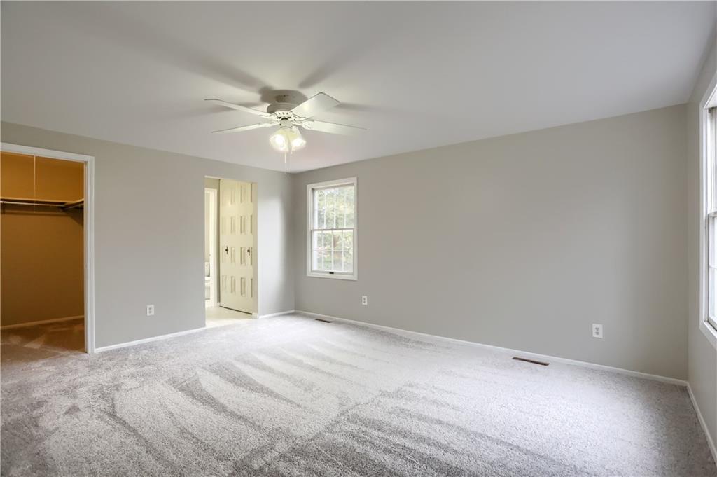 1889 Fairhill Road Allison Park, PA 15101 - Photo 17 of 25 The master bedroom has a large walk in closet, newer wall to wall carpeting and a lighted ceiling fan.