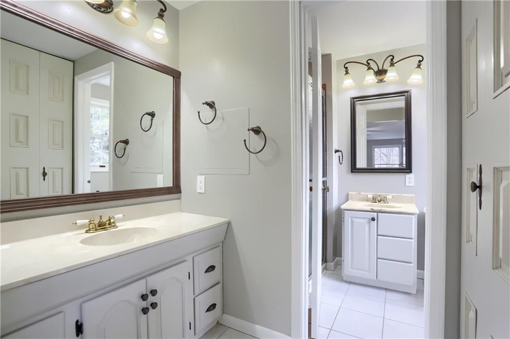 1889 Fairhill Road Allison Park, PA 15101 - Photo 18 of 25 The master bath has a dressing area with a double vanity single sink, a large linen closet, and a separate room with a shower, another vanity with a window.
