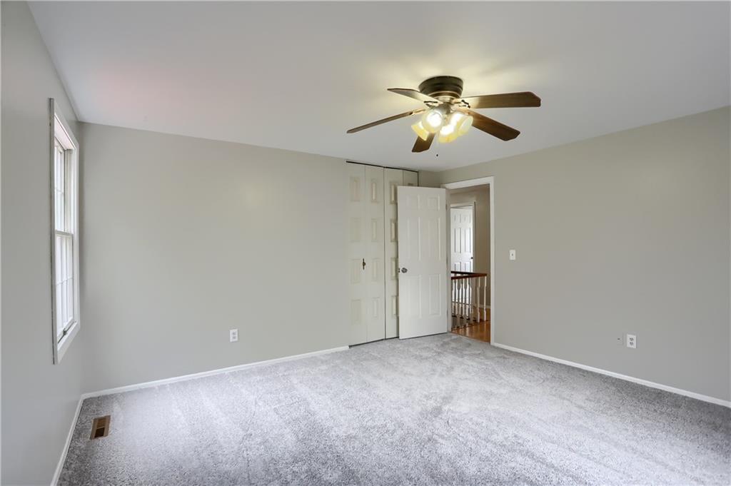 1889 Fairhill Road Allison Park, PA 15101 - Photo 21 of 25 The fourth bedroom has newer carpeting, a double closet, and a lighted ceiling fan.