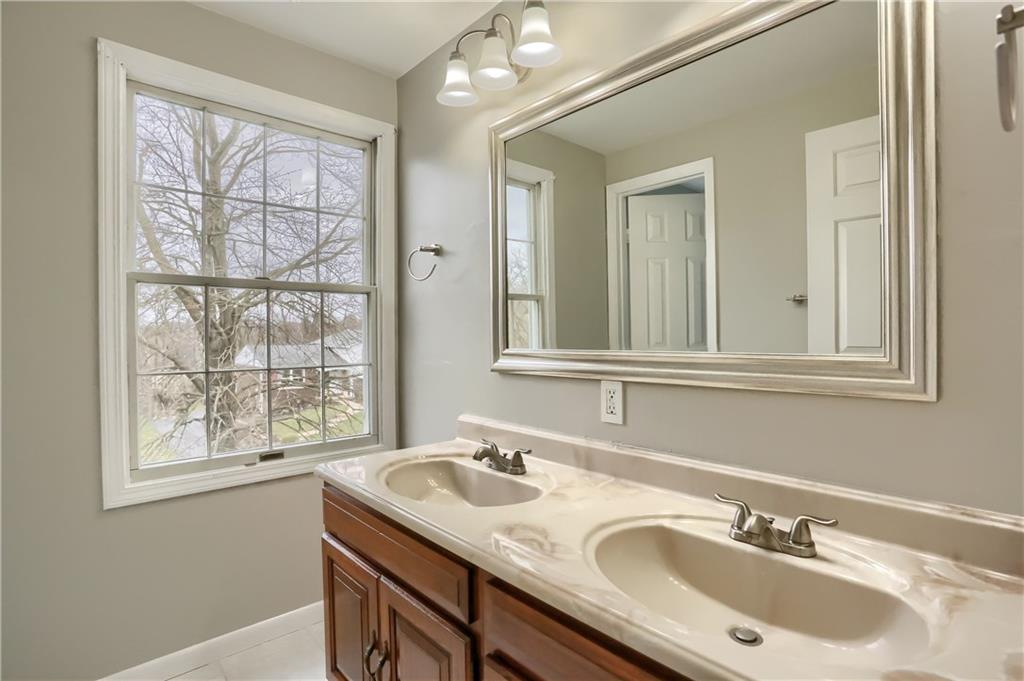 1889 Fairhill Road Allison Park, PA 15101 - Photo 22 of 25 The hall bath has a double vanity sink, a separate room with the tub and shower and two windows!