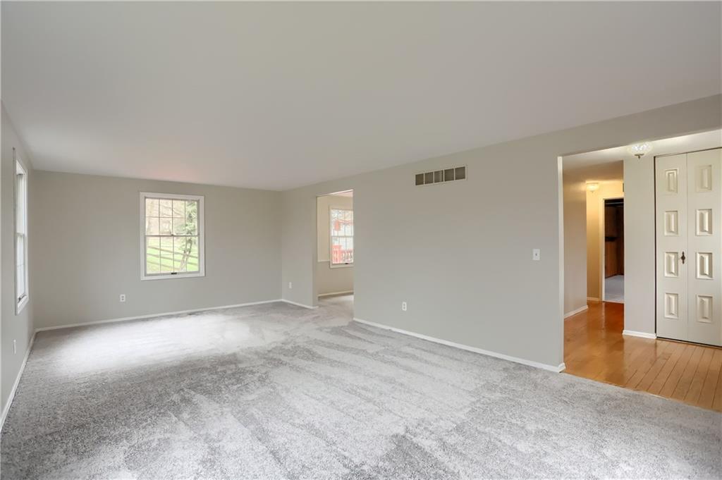 1889 Fairhill Road Allison Park, PA 15101 - Photo 4 of 25 The living room is light and bright with newer (2020) neutral wall to wall carpeting.