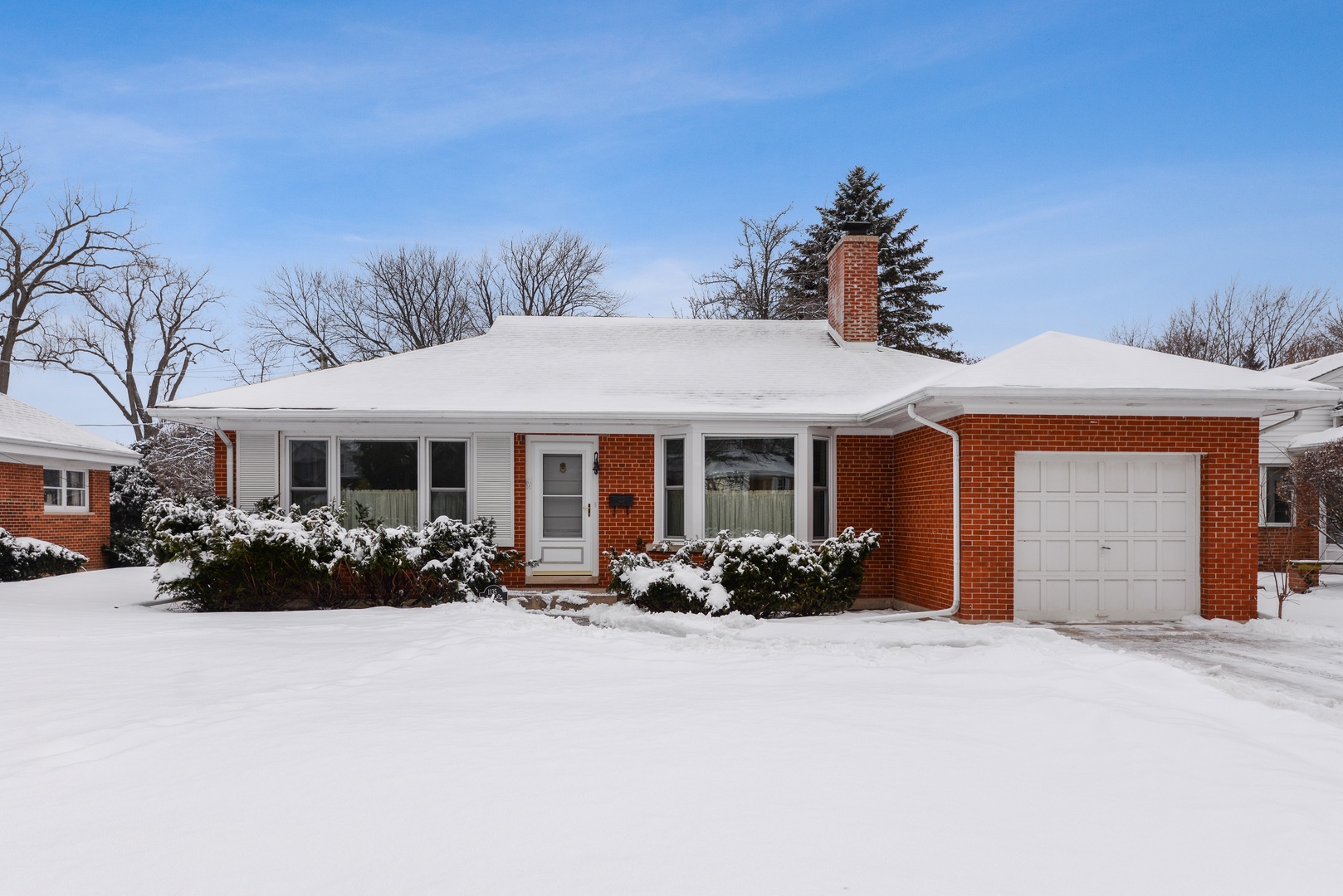 1135 Ridge Road Wilmette, IL 60091 - Photo 2 of 16 a front view of a house with a yard