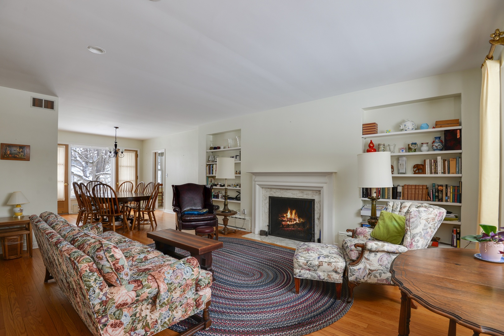 1135 Ridge Road Wilmette, IL 60091 - Photo 5 of 16 a living room with furniture and a fireplace