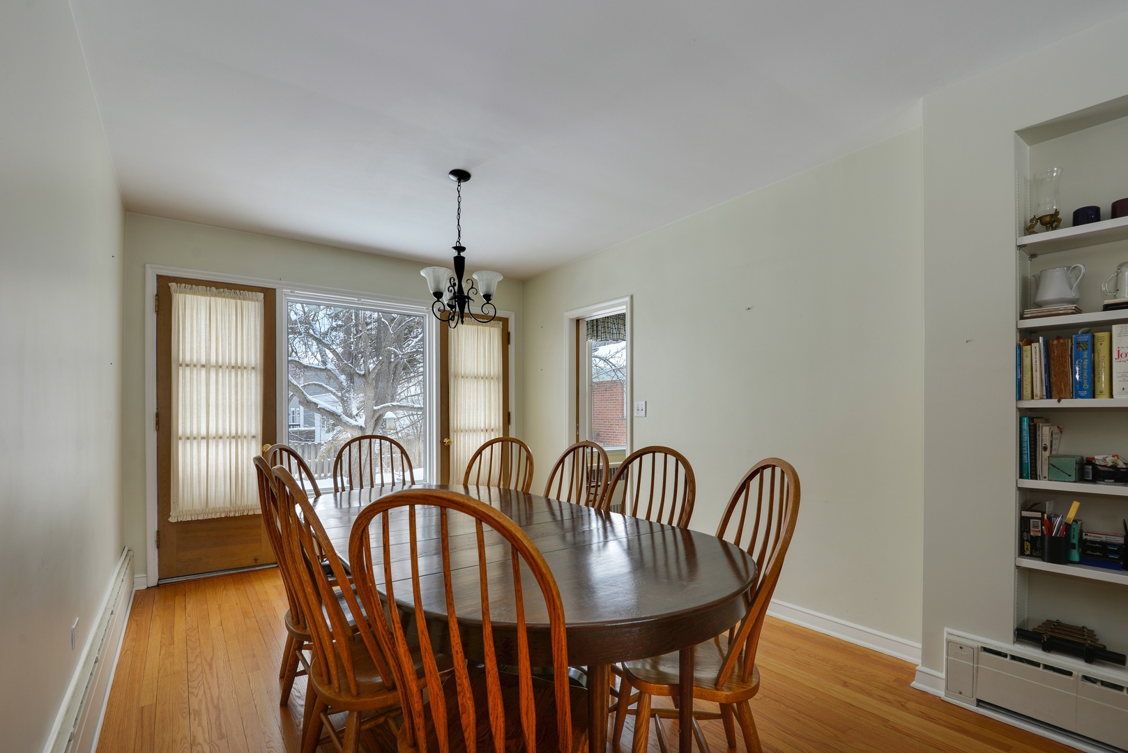 1135 Ridge Road Wilmette, IL 60091 - Photo 6 of 16 a view of a a dining room with furniture window and wooden floor