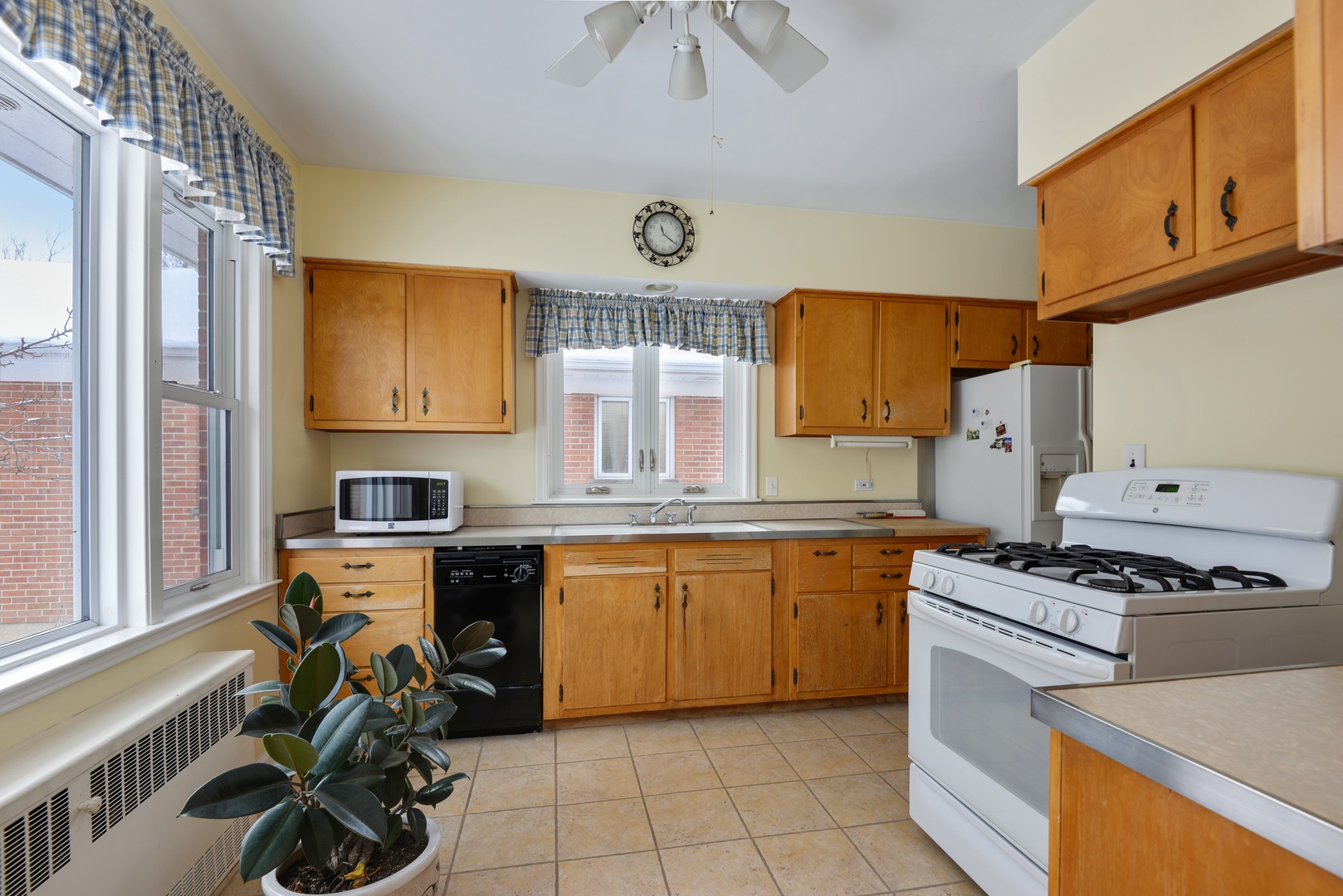 1135 Ridge Road Wilmette, IL 60091 - Photo 7 of 16 a kitchen with stainless steel appliances a stove a sink and a refrigerator