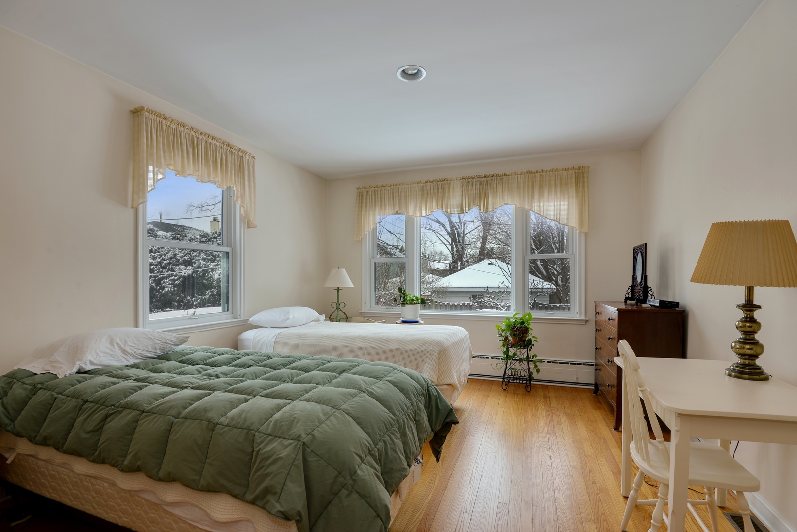 1135 Ridge Road Wilmette, IL 60091 - Photo 9 of 16 a bedroom with a bed and large windows