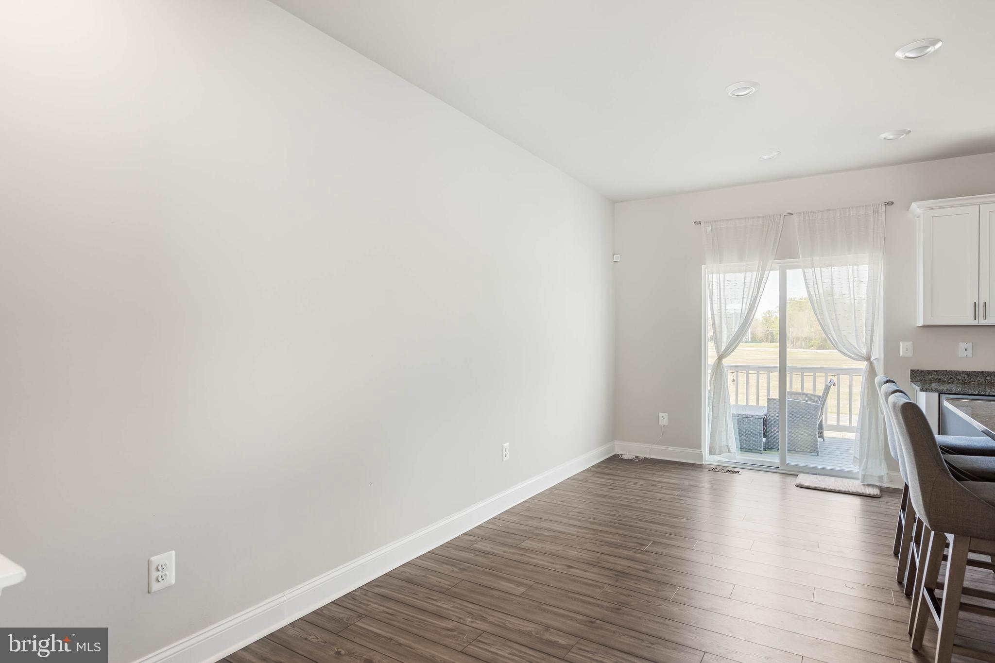 35303 Wright Way Millsboro, DE 19966 - Photo 12 of 26 a view of workspace with wooden floor and fireplace