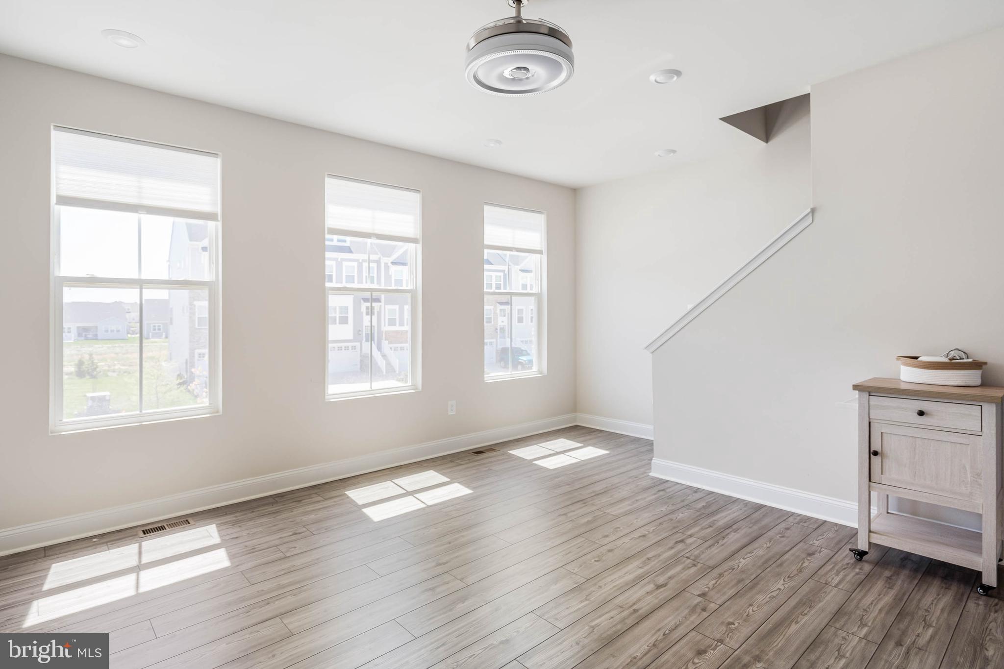 35303 Wright Way Millsboro, DE 19966 - Photo 15 of 26 wooden floor in an empty room with a window