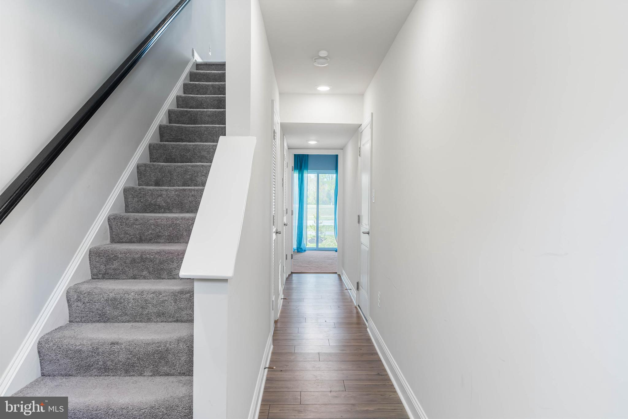 35303 Wright Way Millsboro, DE 19966 - Photo 3 of 26 a view of entryway and hall with wooden floor