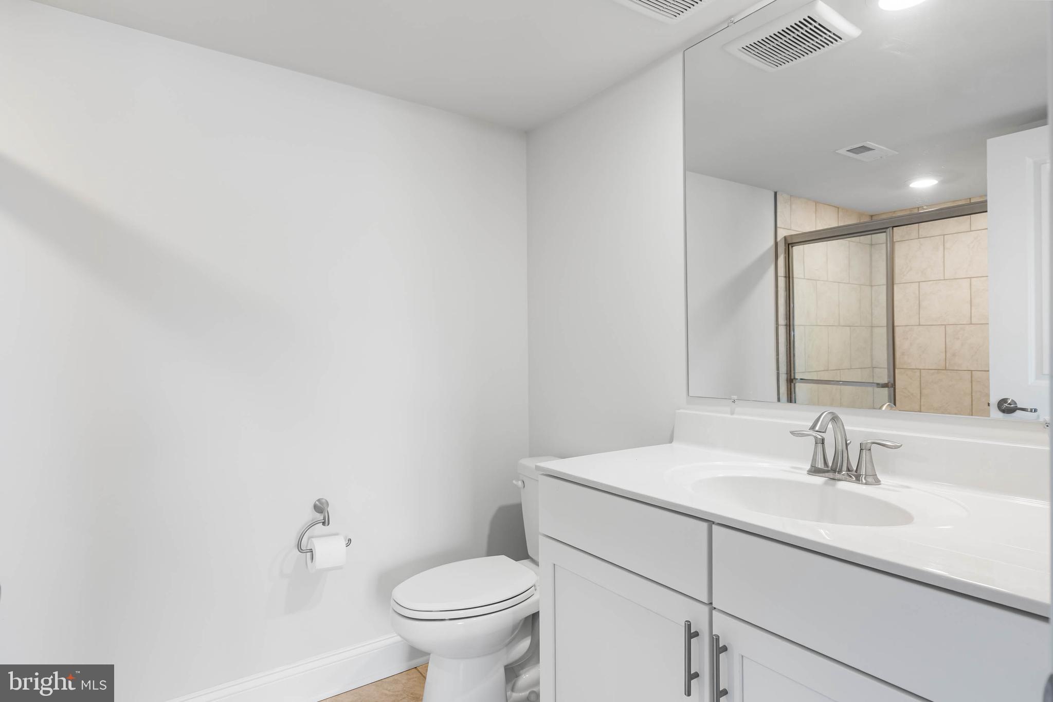 35303 Wright Way Millsboro, DE 19966 - Photo 6 of 26 a bathroom with a sink toilet and a mirror
