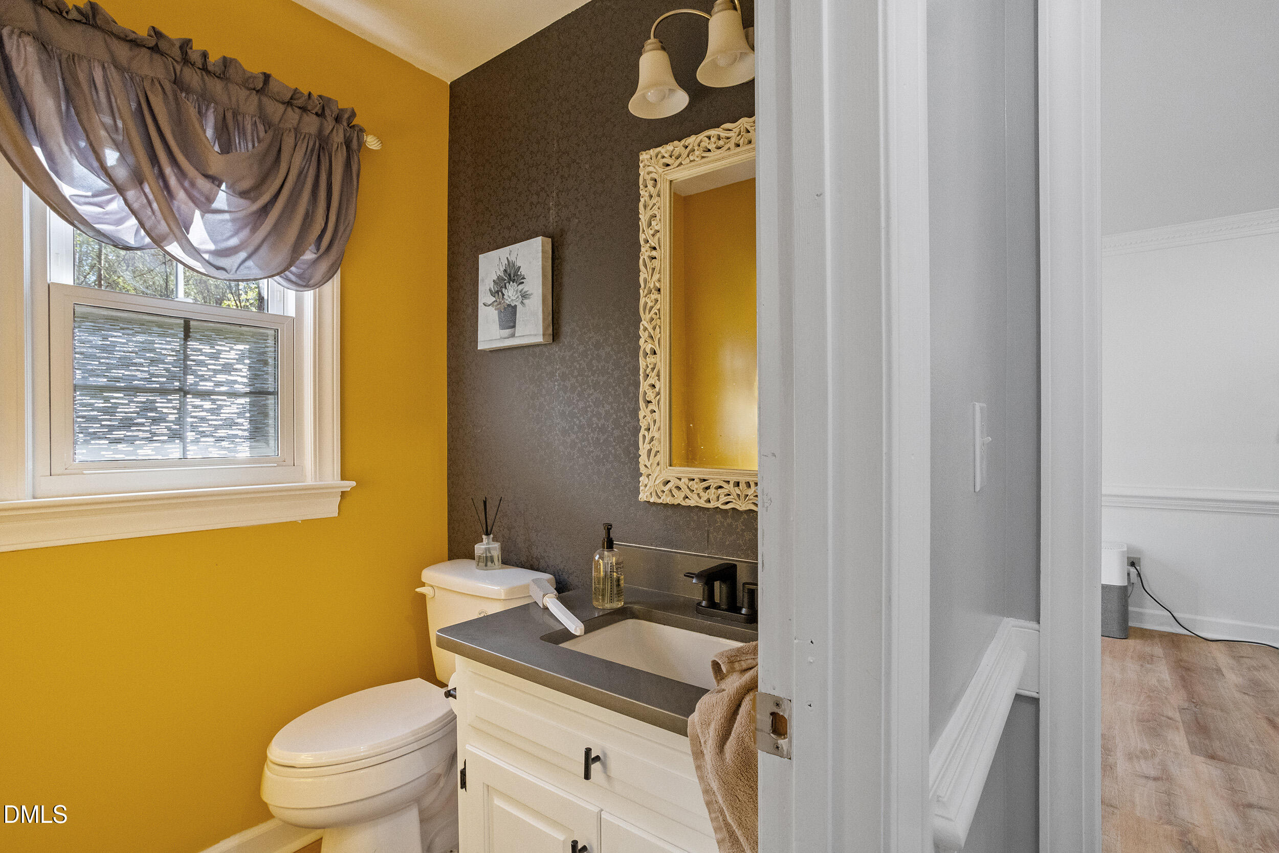 105 Barrett Place Durham, NC 27713 - Photo 15 of 25 a bathroom with a sink a toilet and a mirror
