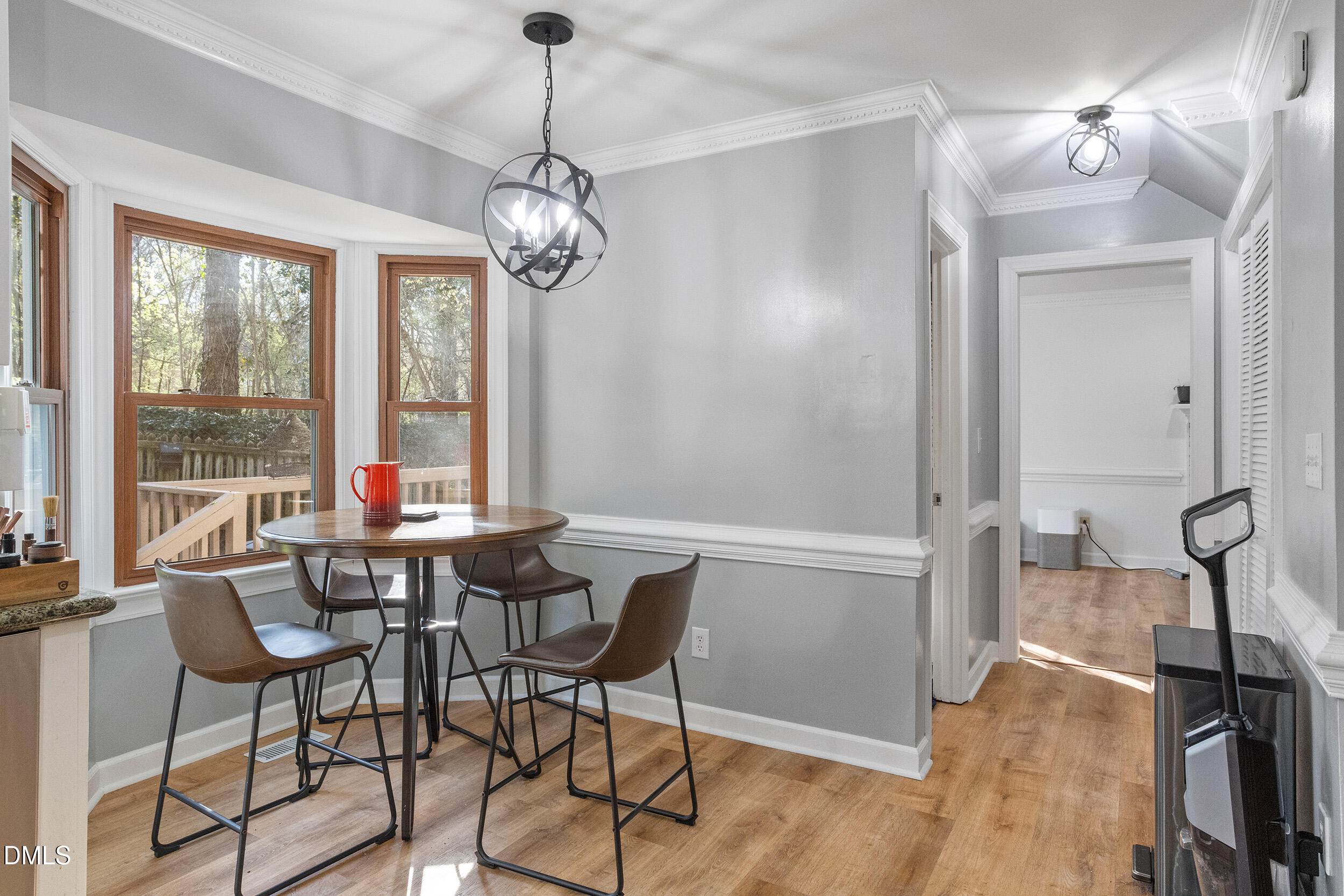 105 Barrett Place Durham, NC 27713 - Photo 19 of 25 a view of a dining room with furniture window and wooden floor