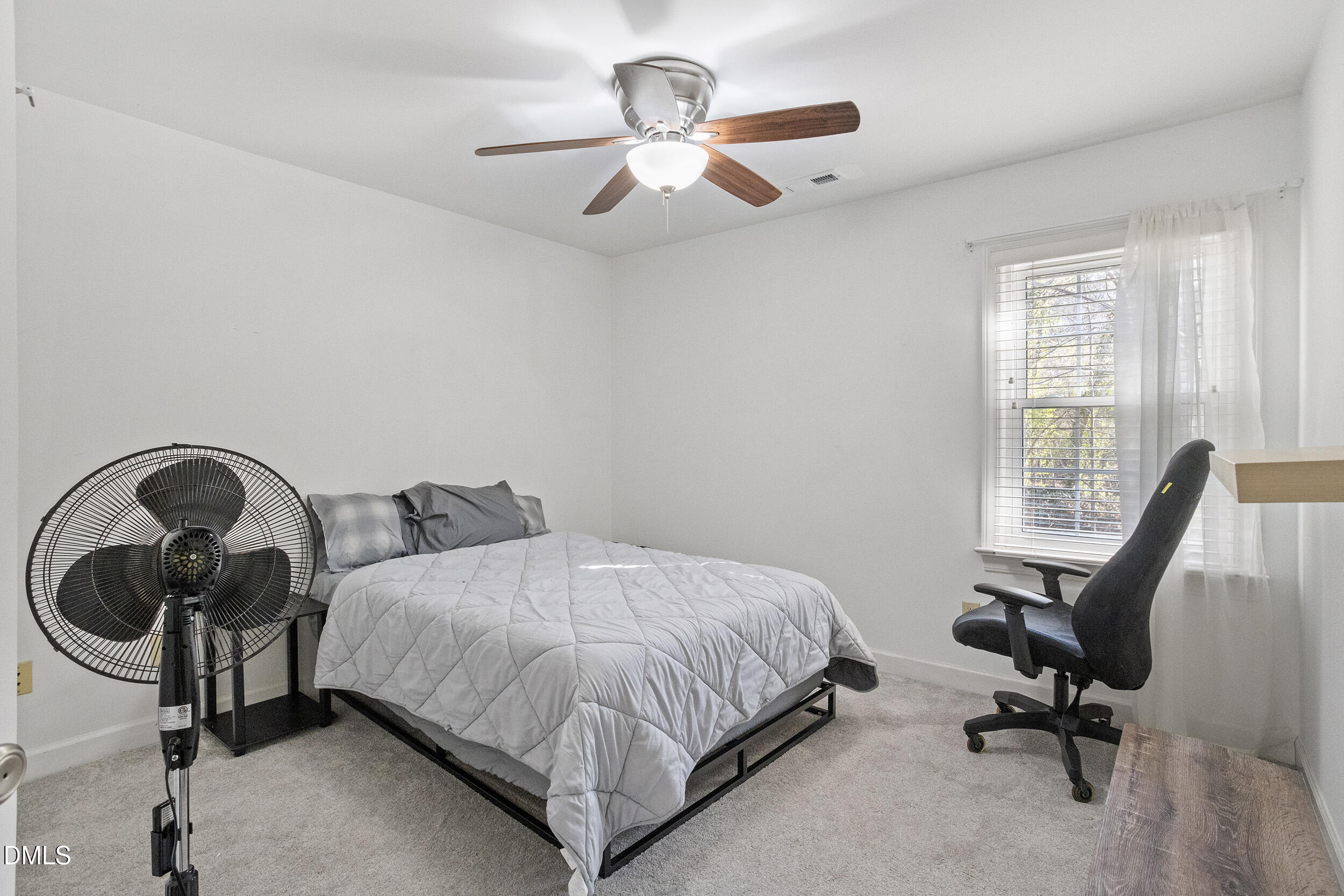 105 Barrett Place Durham, NC 27713 - Photo 25 of 25 a bedroom with a bed a desk and chair