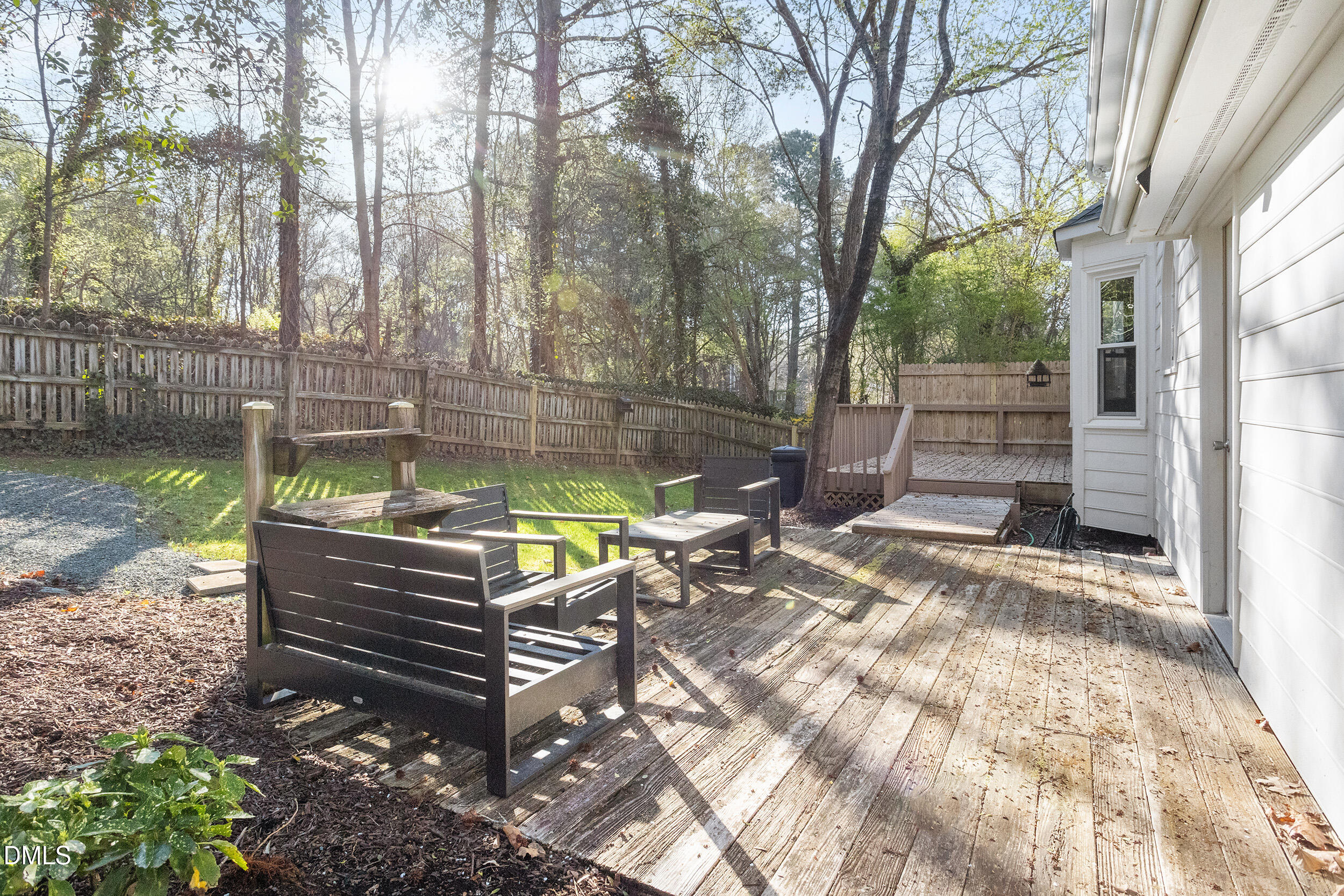 105 Barrett Place Durham, NC 27713 - Photo 4 of 25 a view of a bench in a backyard