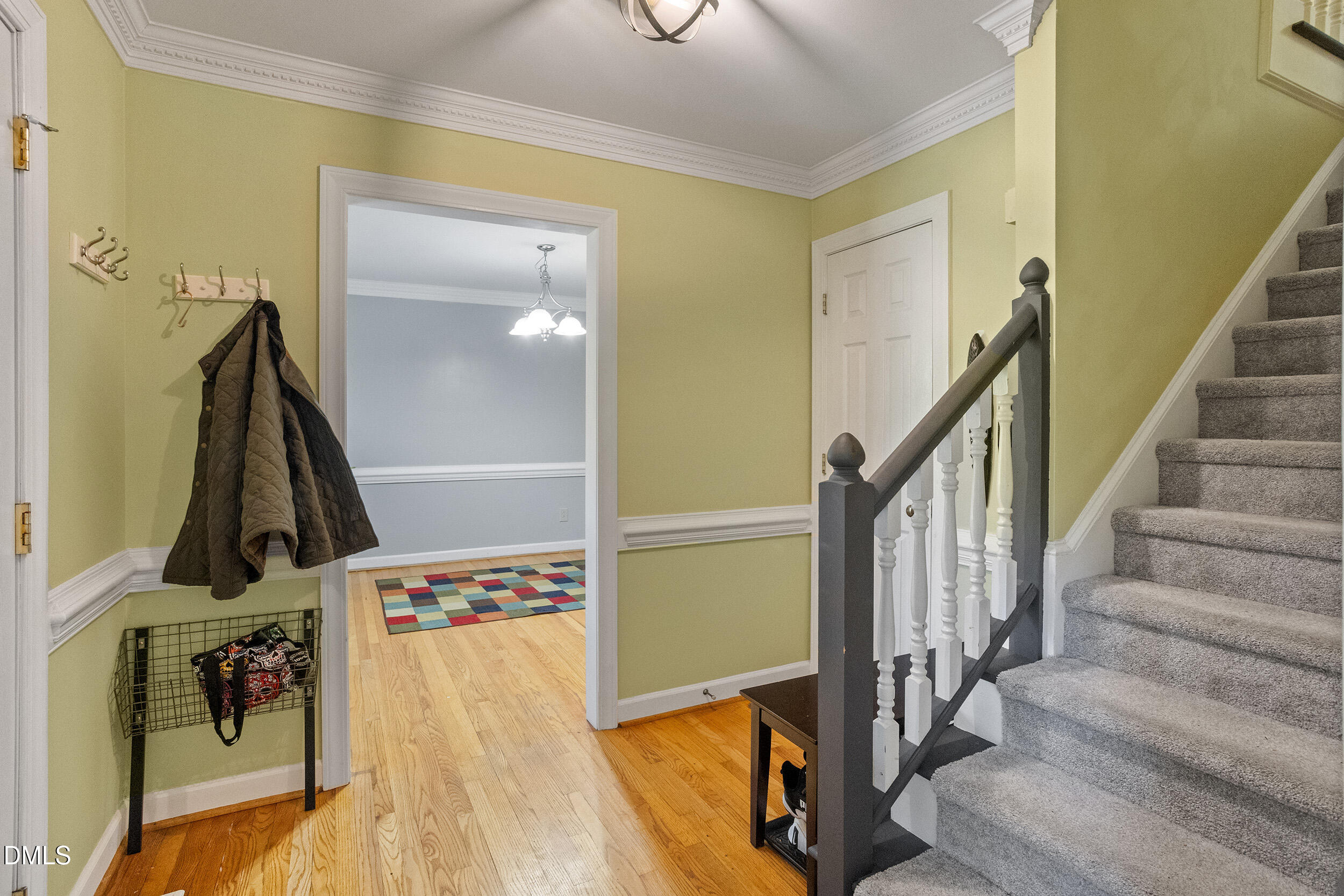 105 Barrett Place Durham, NC 27713 - Photo 7 of 25 a view of a hallway with wooden floor and entryway