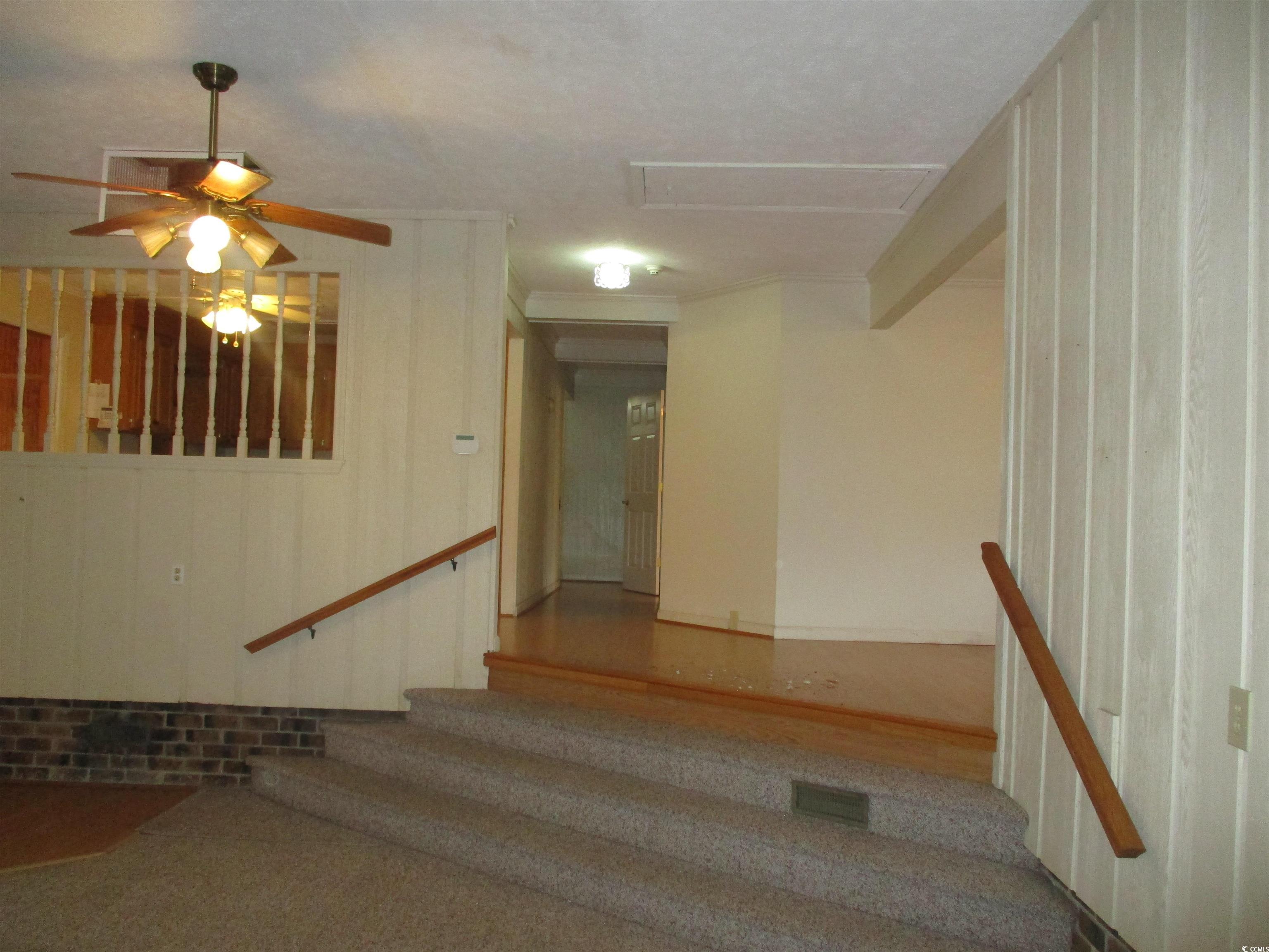 730 Highway 348 Loris, SC 29569 - Photo 11 of 36 Stairs with ceiling fan