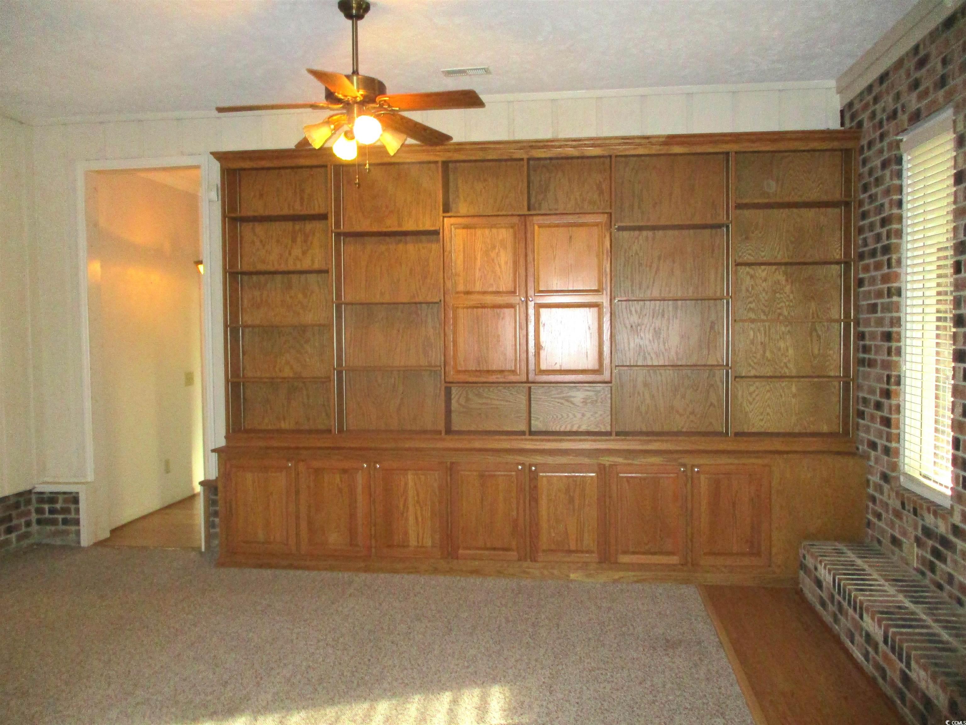 730 Highway 348 Loris, SC 29569 - Photo 13 of 36 Unfurnished living room featuring a textured ceili
