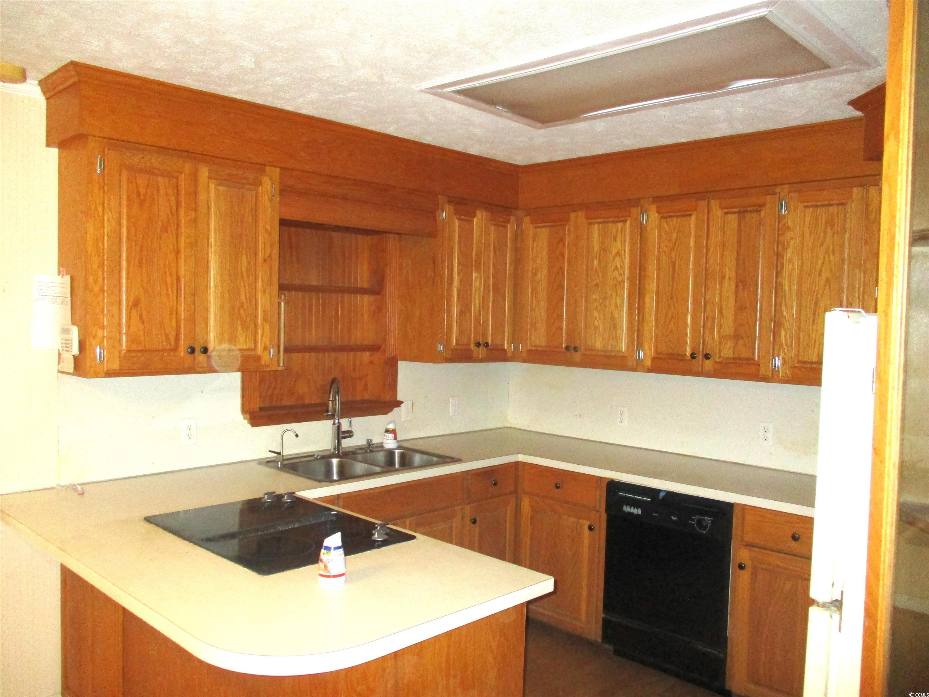 730 Highway 348 Loris, SC 29569 - Photo 14 of 36 Kitchen with black appliances, a textured ceiling,