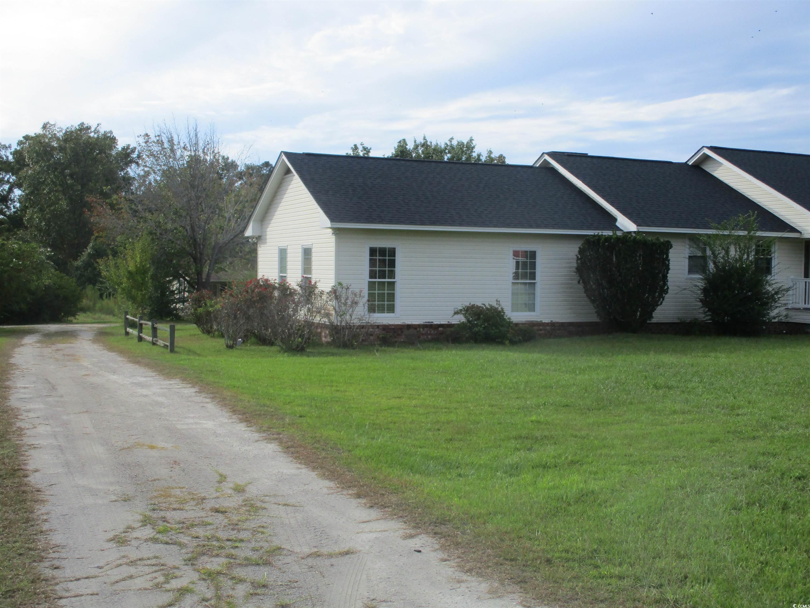 730 Highway 348 Loris, SC 29569 - Photo 2 of 36 View of home's exterior with a yard