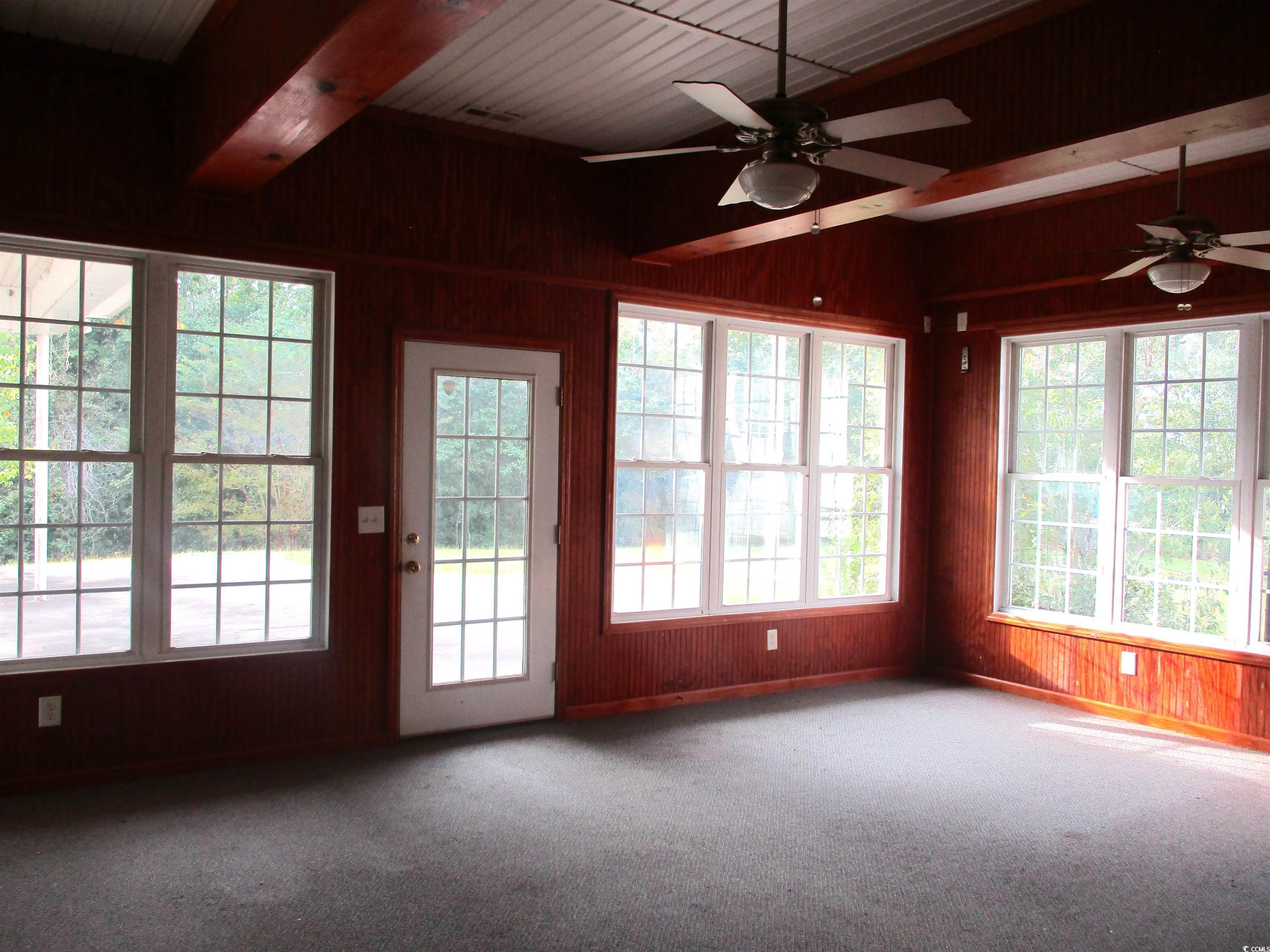 730 Highway 348 Loris, SC 29569 - Photo 28 of 36 Unfurnished sunroom featuring ceiling fan and beam