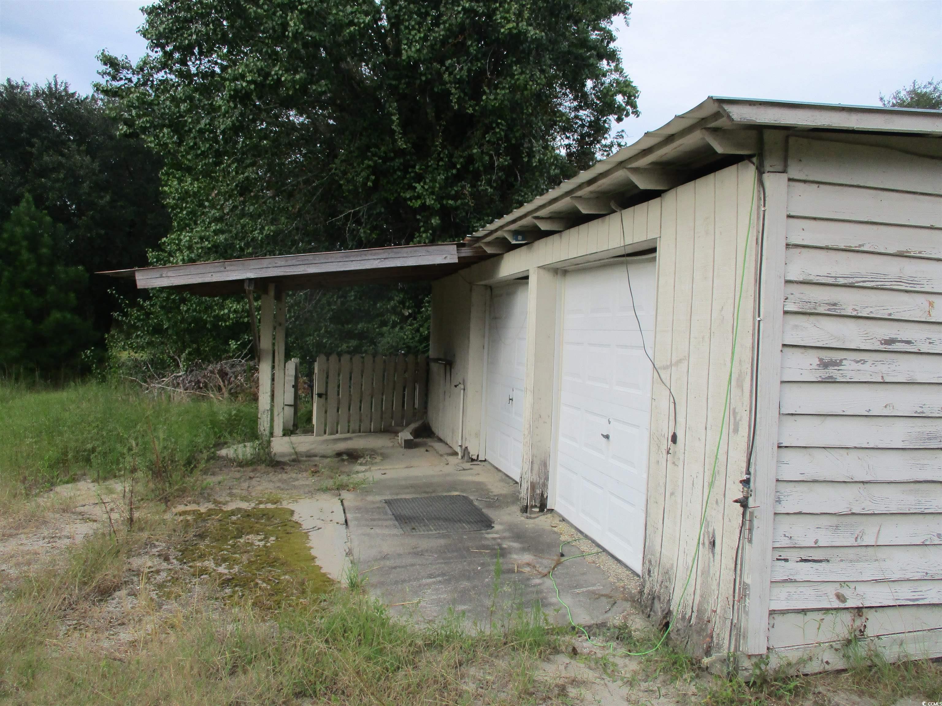 730 Highway 348 Loris, SC 29569 - Photo 34 of 36 Garage with a carport