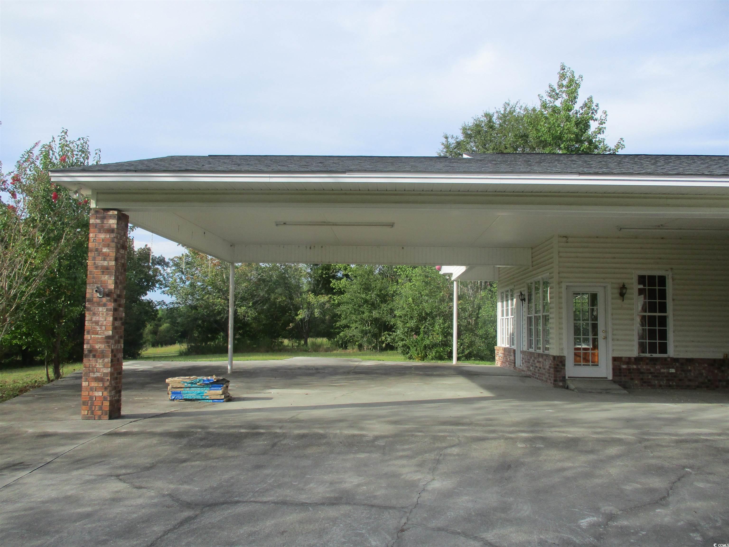 730 Highway 348 Loris, SC 29569 - Photo 7 of 36 View of parking / parking lot with a carport