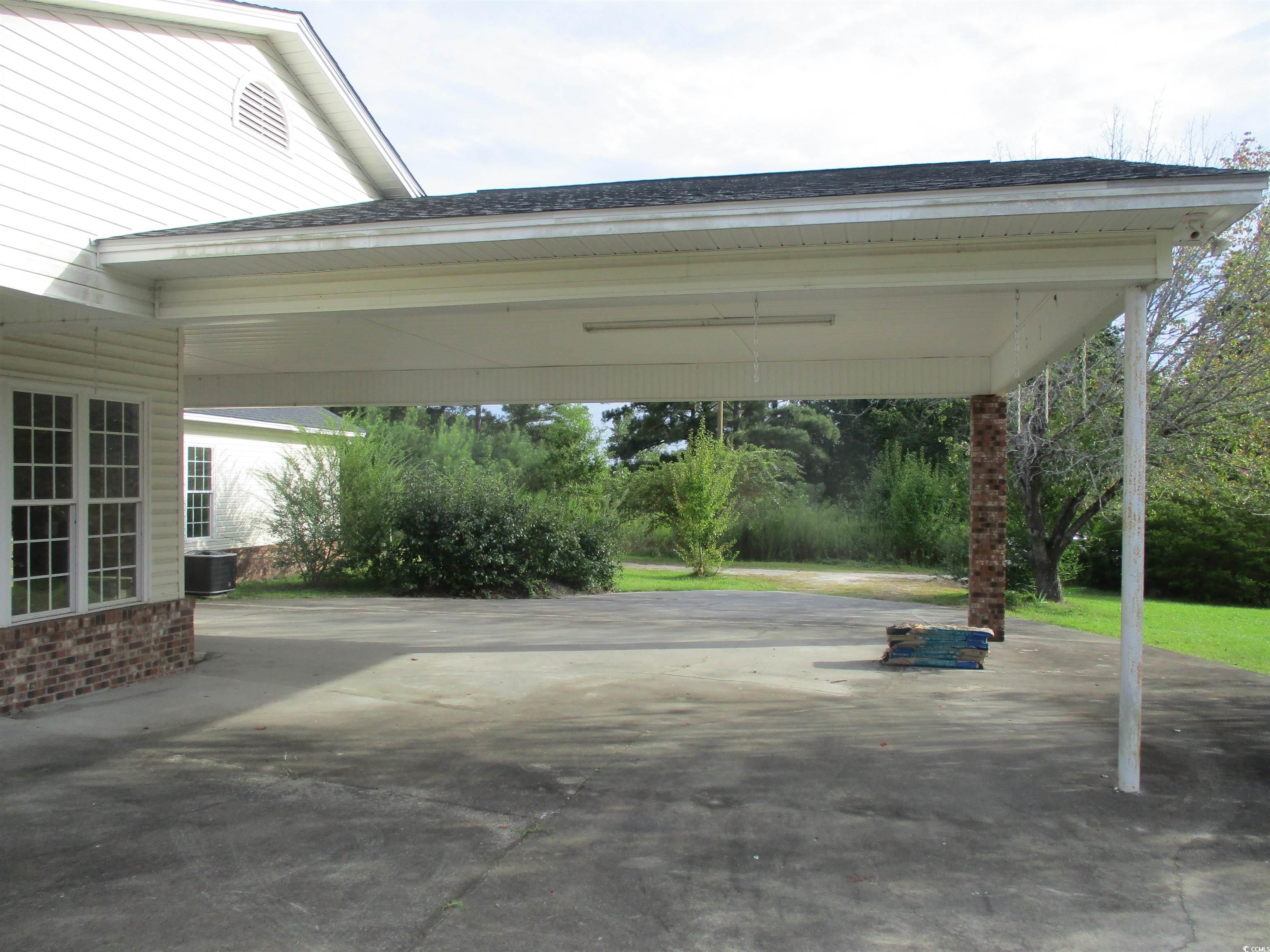 730 Highway 348 Loris, SC 29569 - Photo 8 of 36 View of vehicle parking with a carport