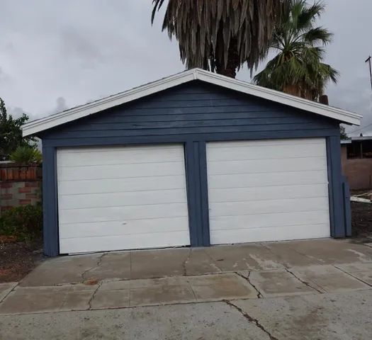a small white house with a outdoor space