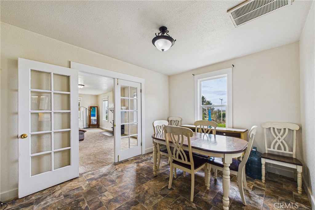 5863 Elk River Road Eureka, CA 95503 - Photo 13 of 42 a view of a dining room with furniture and a table