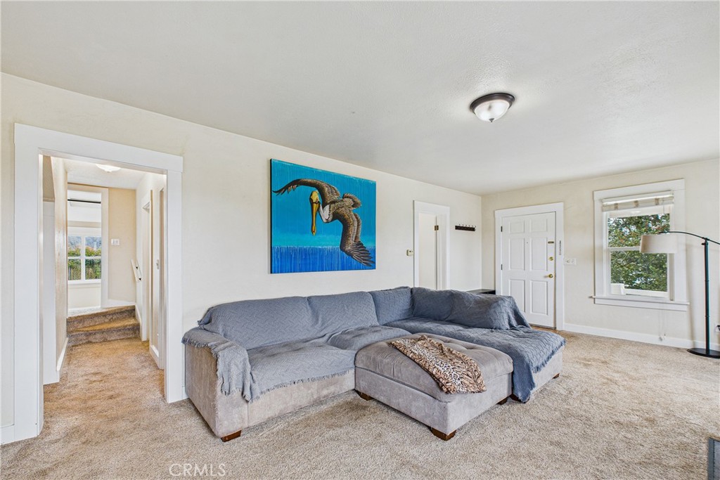 5863 Elk River Road Eureka, CA 95503 - Photo 18 of 42 a living room with furniture and a window