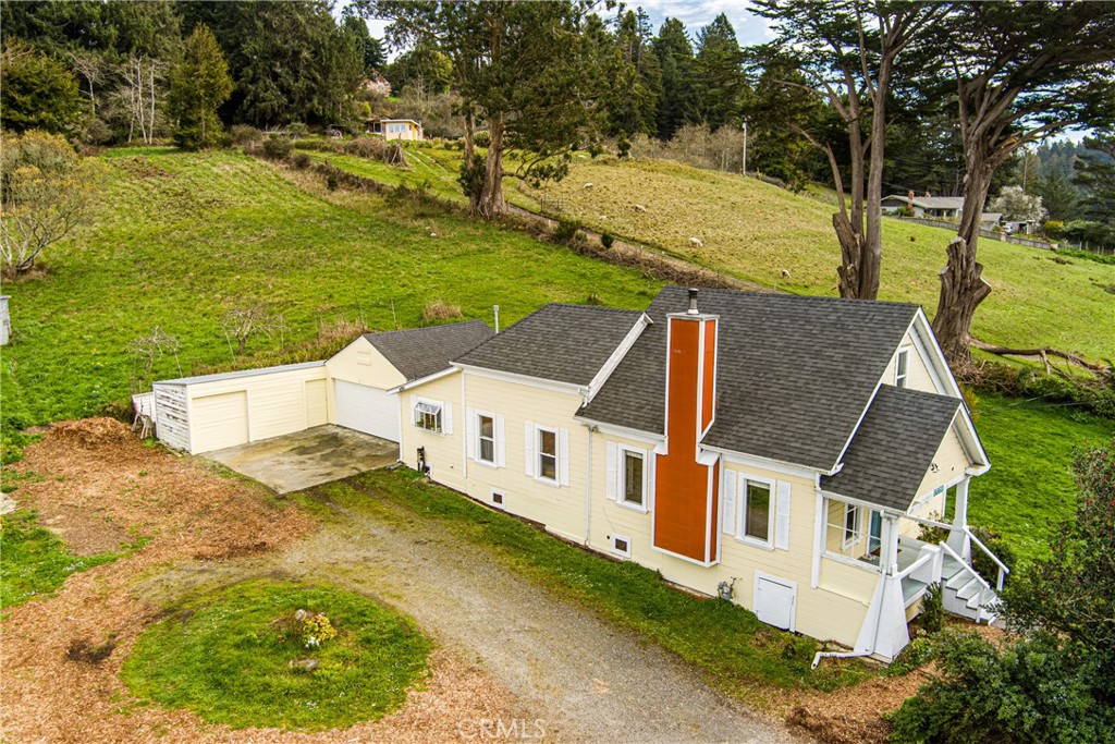 5863 Elk River Road Eureka, CA 95503 - Photo 2 of 42 an aerial view of residential houses with outdoor space and trees