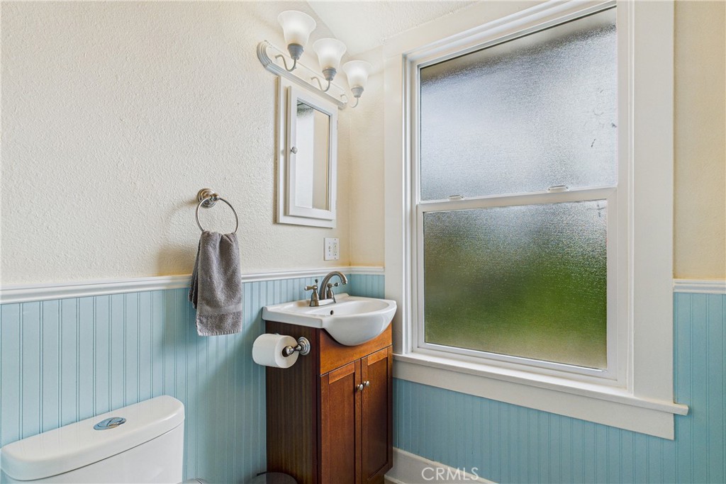 5863 Elk River Road Eureka, CA 95503 - Photo 22 of 42 a bathroom with a sink mirror and toilet