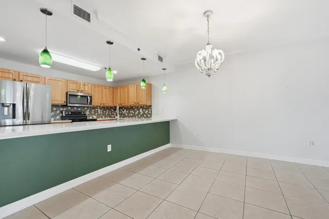 a spacious bedroom with a bed and a large window