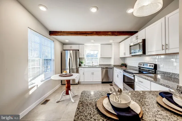 a view of a roof deck with wooden floor and fence