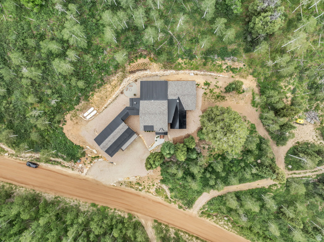 1766 West Tollgate Cyn Road Coalville, UT 84017 - Photo 56 of 59 Aerial perspective showcasing a modern residence with a multi-pitched roofline and an attached covered structure