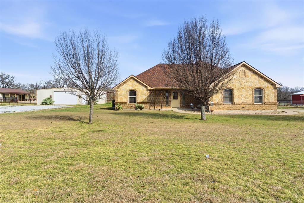 a view of house with outdoor space and swimming pool